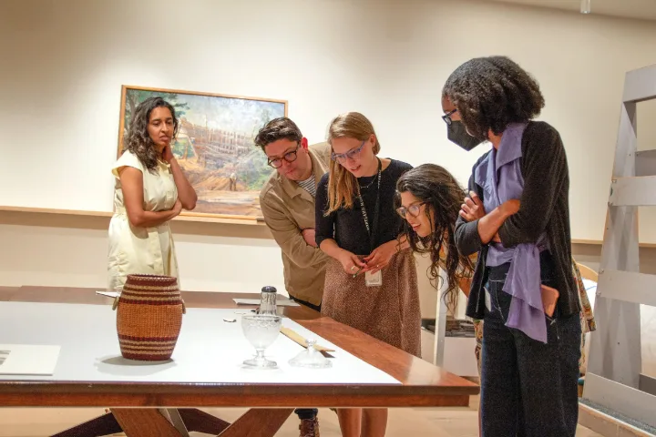 5 people viewing an exhibit