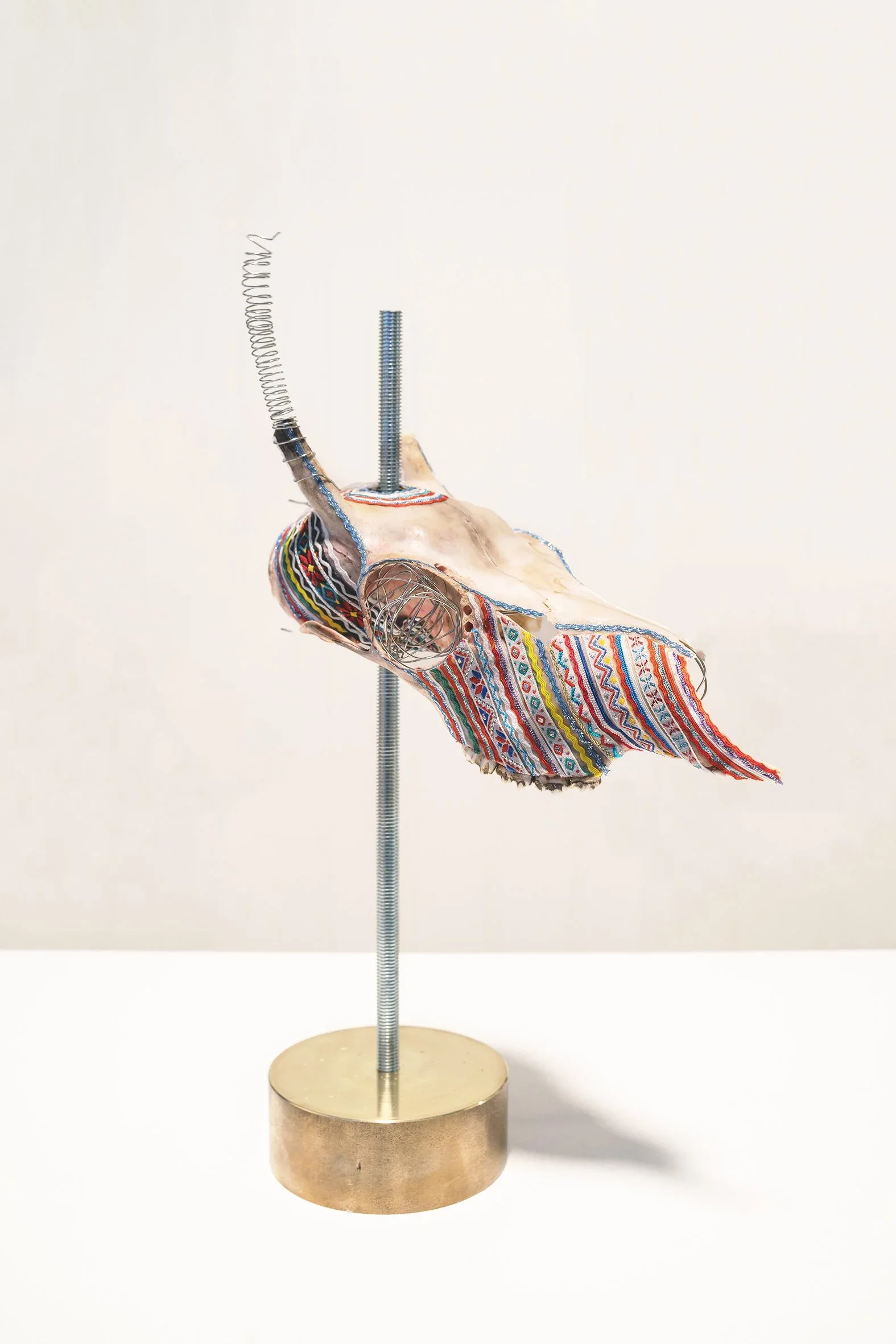 Marét Ánne Sara, (Norway, born 1983), Wear your down as your ups, couse this dance will twist you inside out , 2021. Reindeer heads decorated with Guovdageaidnu gákti (traditional Sámi dress from the artist’s area), poles: 35 7/16 x 15 3/4 inches; heads: approx. 9 27/32 x 5 29/32 inches, each. Courtesy of the artist. © Marét Ánne Sara. Photo by Karl Alfred Larsen