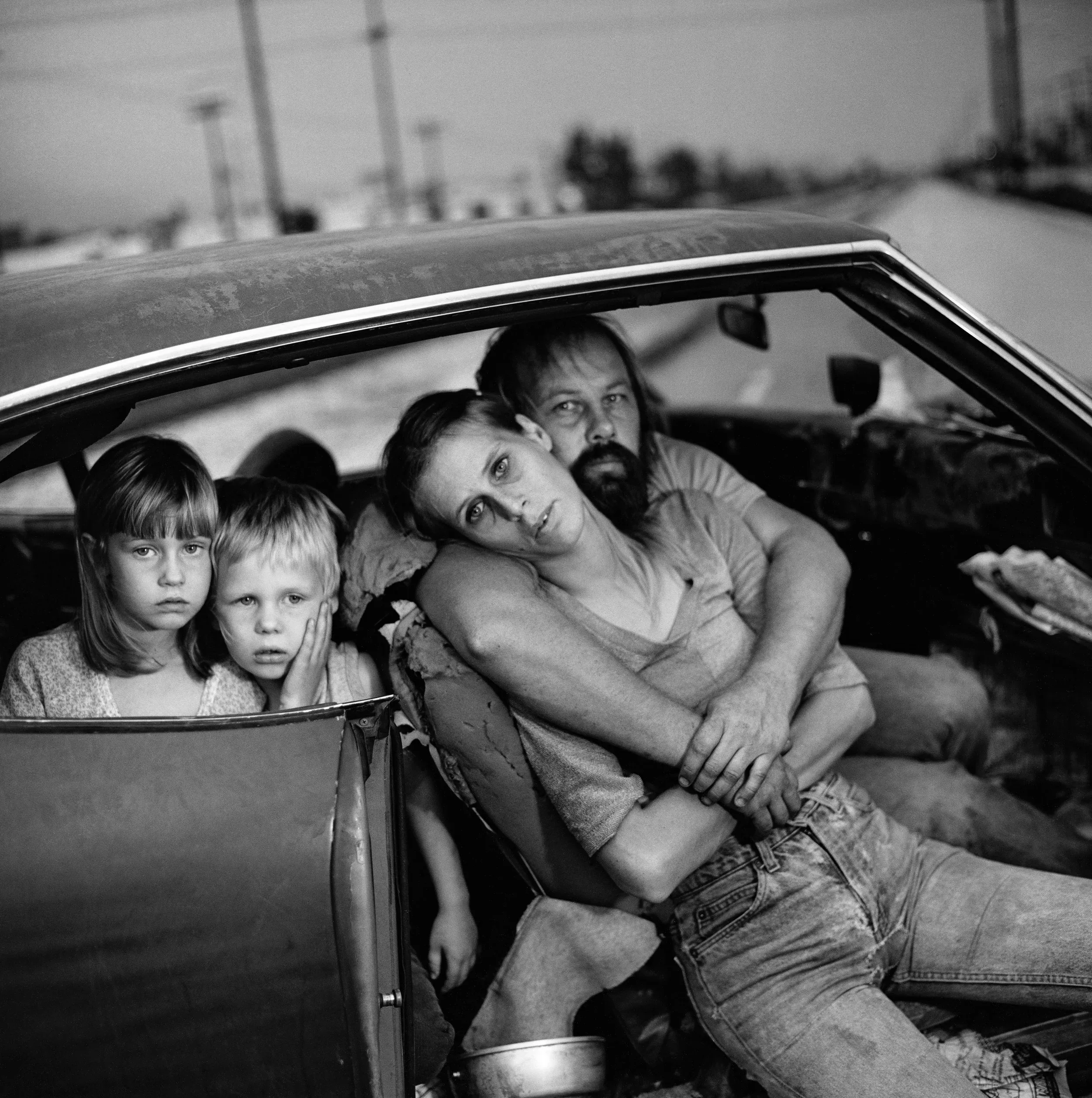 Mary Ellen Mark (United States, 1940–2015), The Damm Family in Their Car, Los Angeles, California , 1987, gelatin silver print, 10 3/16 x10 1/4 inches. Portland Museum of Art, Maine. Gift of the artist for the Ernst Haas Memorial Collection, 1998.74. Image courtesy The Mary Ellen Mark Foundation. © Mary Ellen Mark/The Mary Ellen Mark Archive