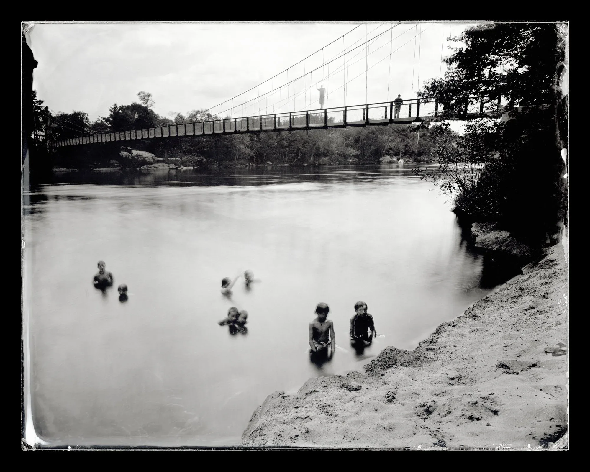 Michael Kolster (United States, born 1963), Swimmers, Swinging Bridge, Topsham, Maine , 2012, archival pigment print, 32 x 40 inches. Gift of Jeanne and Richard S. Press, 2021.15.2. Courtesy of Michael Kolster. © Michael Kolster