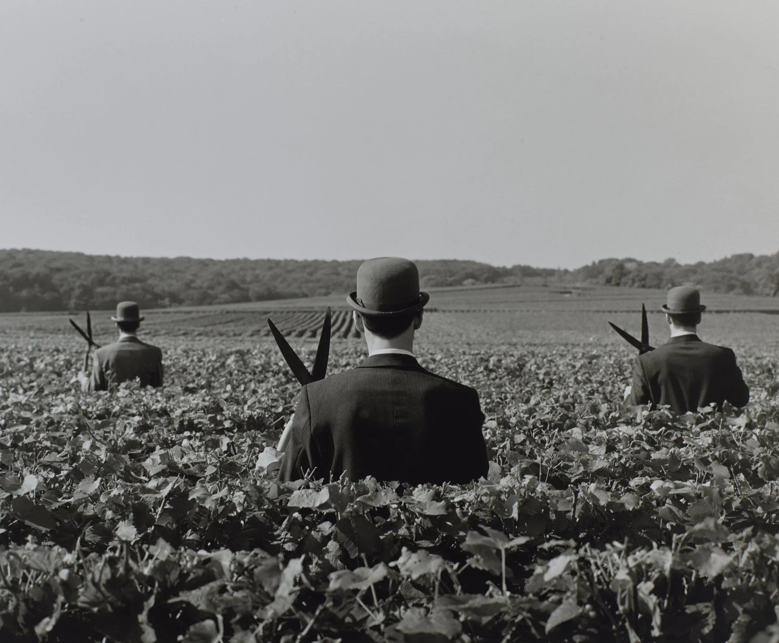 Rodney Smith (United States, 1947–2016), Three Men with Shears No. 1, Reims, France , 1997, gelatin silver print, 10 9/16 x 13 inches. Portland Museum of Art, Maine. Gift of Leslie Smolan 2022.19.1. Image courtesy Luc Demers. © Rodney Smith