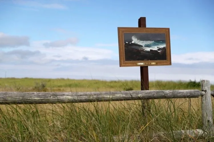 A reproduction of “Weatherbeaten” by Winslow Homer is posted alongside the boardwalk at Scarborough Beach State Park. Ben McCanna/Staff Photographer