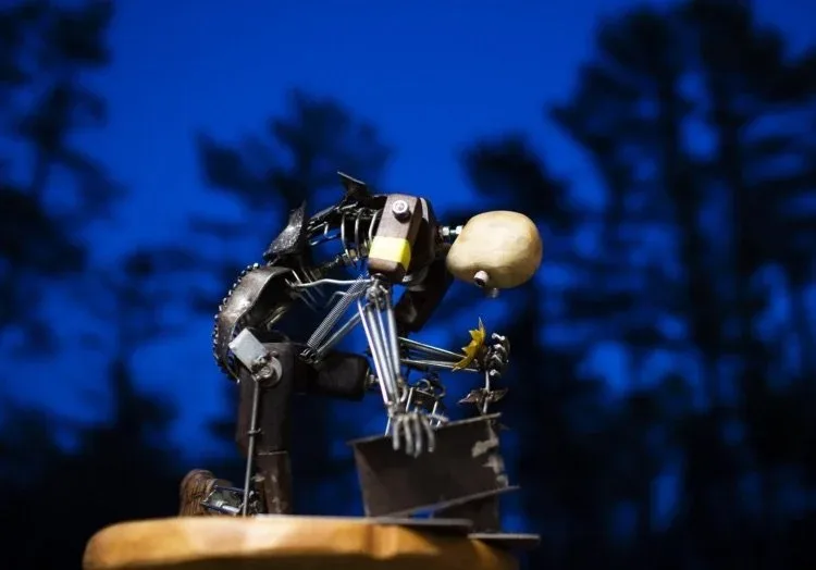 Pochurek holds a sculpture he recently created to represent a Ukranian soldier. Derek Davis/Staff Photographer